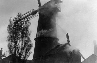 Fireman trying to save the mill 4th May 1913