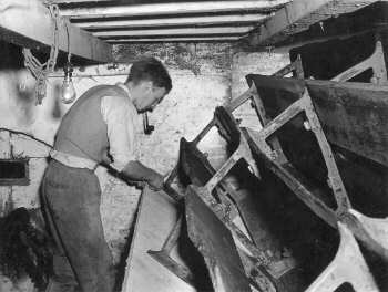 Michael Grix repairing the wheel c.1952