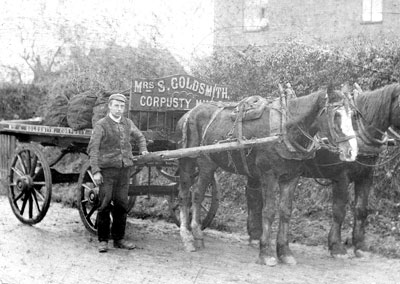 Charles Pegg with Mrs Goldsmith's coal delivery cart c.1903 