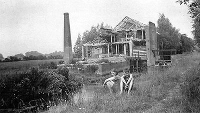 Annie Coulton and brother Bill Denny in front of mill 1920